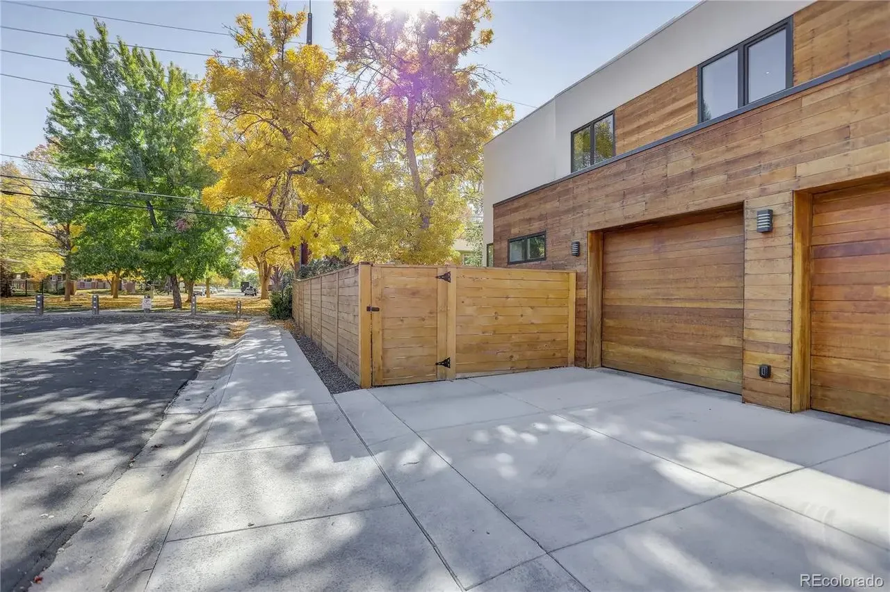 Horizontal wood fence and garage door matching the siding
