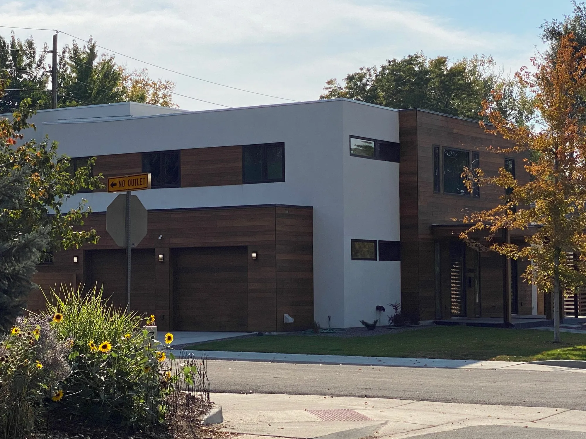 Two-story contemporary custom home with stucco and wood siding