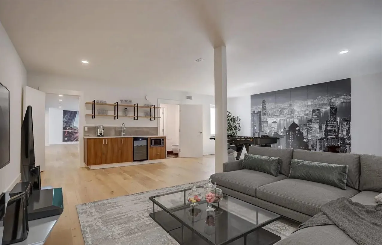 Basement media room with a kitchenette